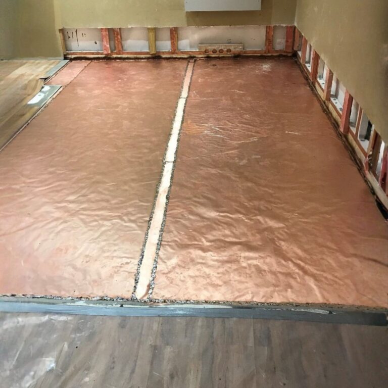 Copper foil shielding laid and soldered on the floor of the MRI room during construction.