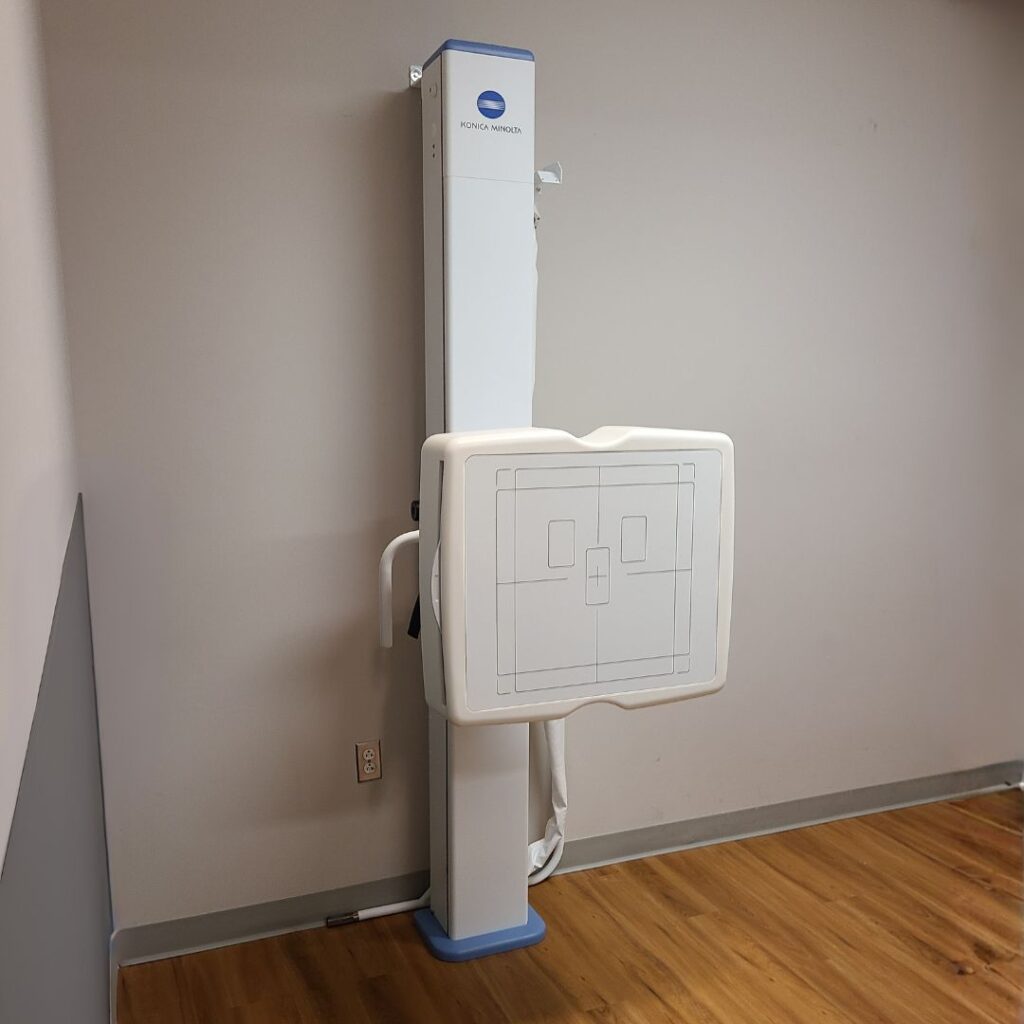 Patient positioning for standing weight-bearing X-ray using Konica Minolta spinal stitching technology.