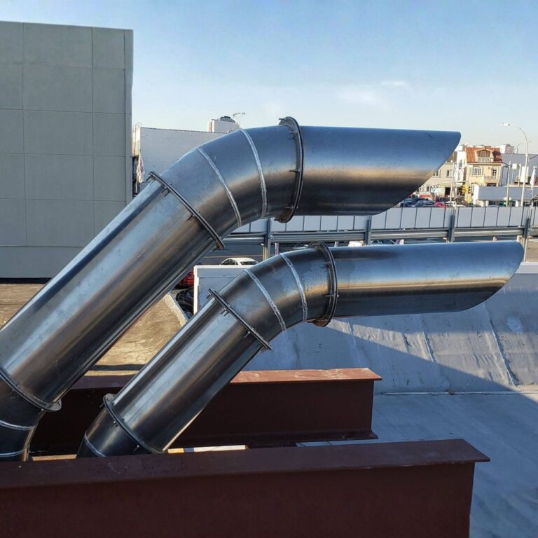 Rooftop view of two finished, parallel cryogen exhaust vents for a hospital or clinic.