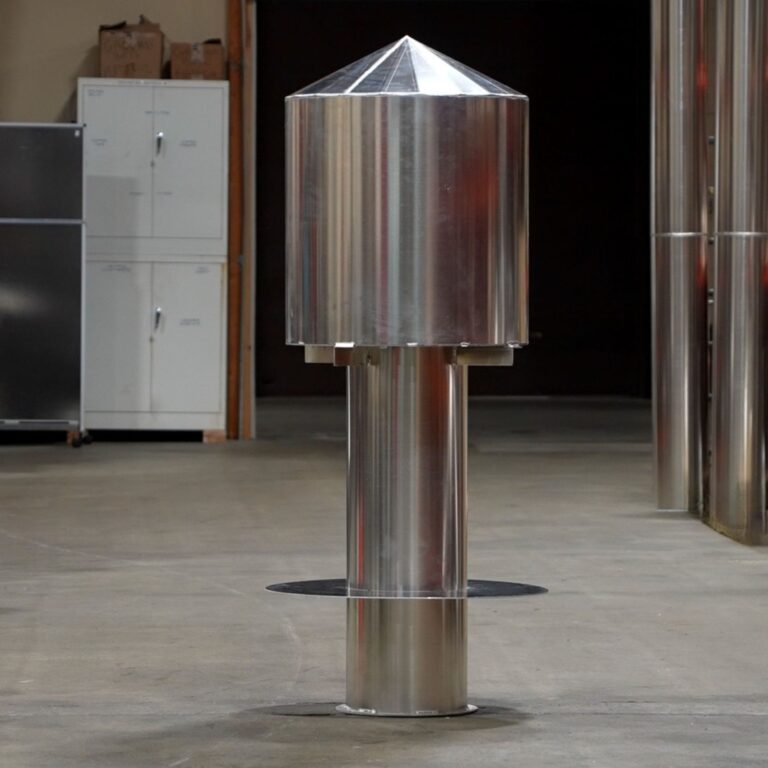 Non ferrous cryogen vent cap with peaked roof, fabricated and ready for rooftop installation.