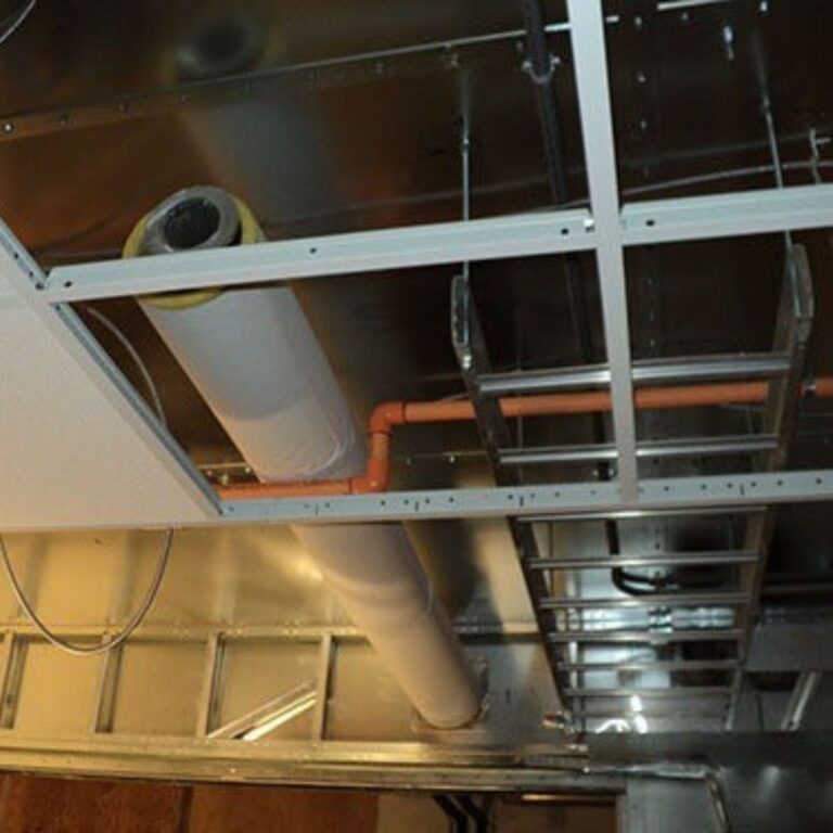 Insulated cryogen vent ductwork installed and supported within the drop ceiling space of the facility.