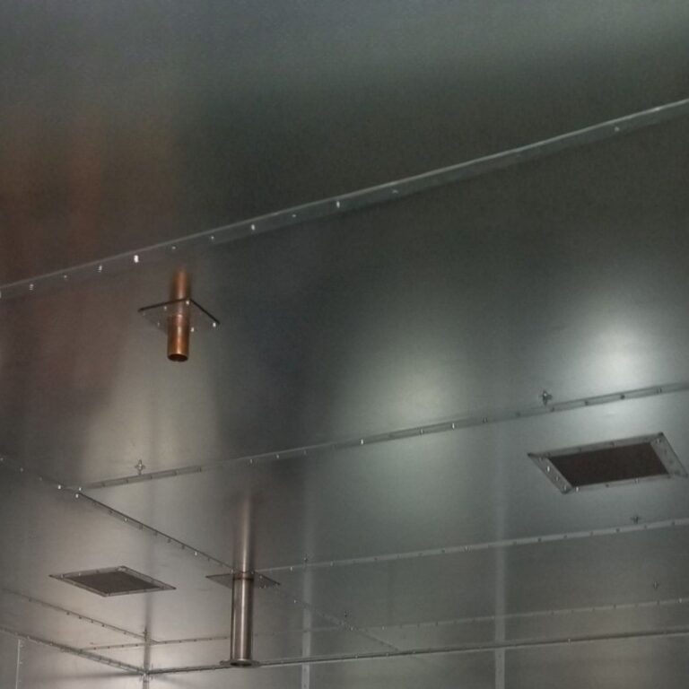 Utility and grounding penetrations in the shielded ceiling, including a copper pipeline pass through.