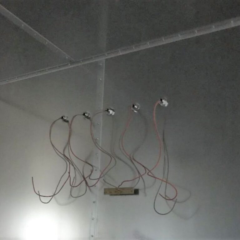 Wiring for low voltage data and signal lines passing through shielded penetrations in the modular wall.