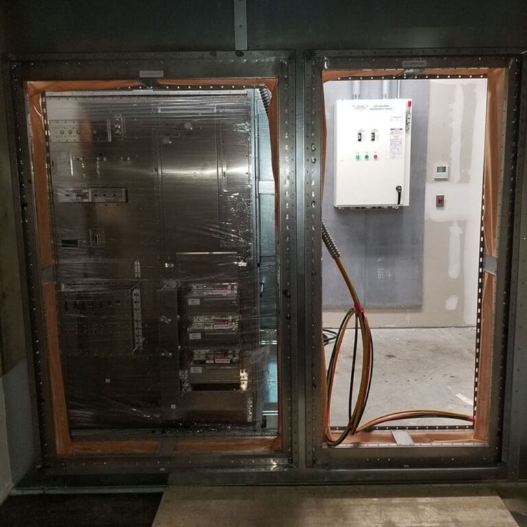 Installation area for the MRI equipment interface cabinet and power cables feeding into the shielded room.