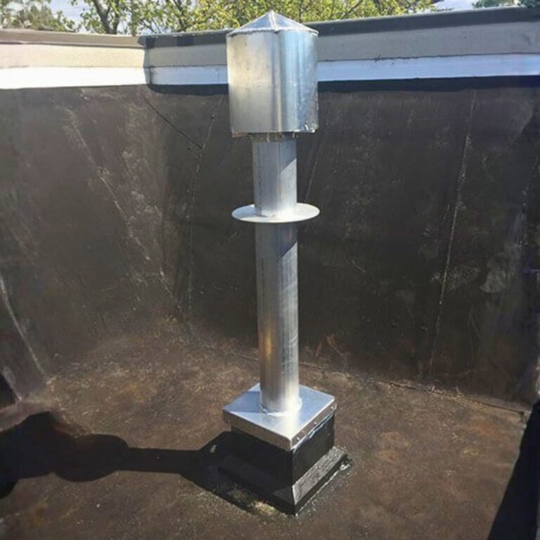 Exterior view of the non ferrous cryogen quench vent termination stack on a facility rooftop.