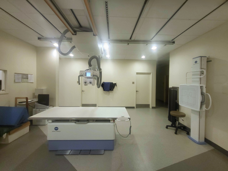 Completed modern radiology room featuring a Konica Minolta digital X ray system and imaging table.