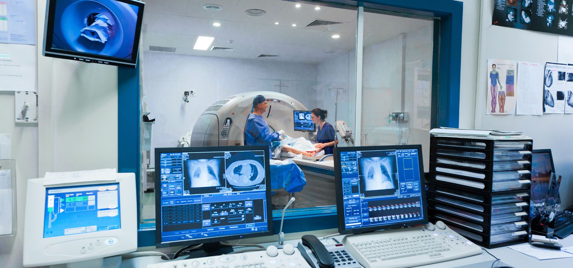 Medical imaging center with CT scan monitors for advanced diagnostic radiology and patient assessments.
