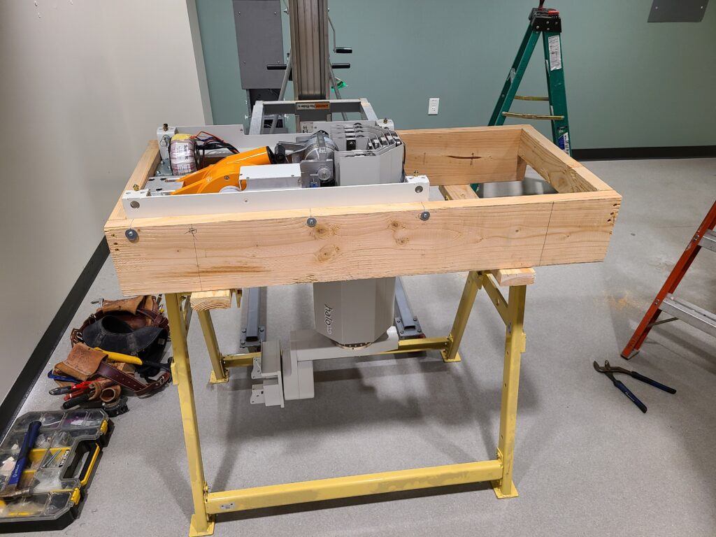 A secured X-ray system component in a protective metal cradle for a technical X-ray equipment relocation.