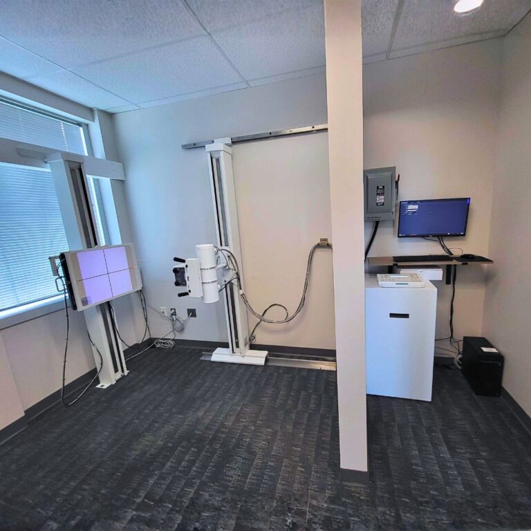 Advanced stationary upright X ray machine for precise patient positioning and high resolution clinical imaging.